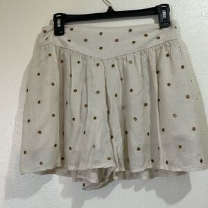 Free People cream colored shorts with gold dots. Size Small